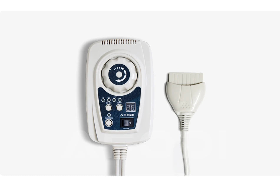 White handheld PEMF therapy controller with digital display, dial, and power button, connected to a flat applicator.