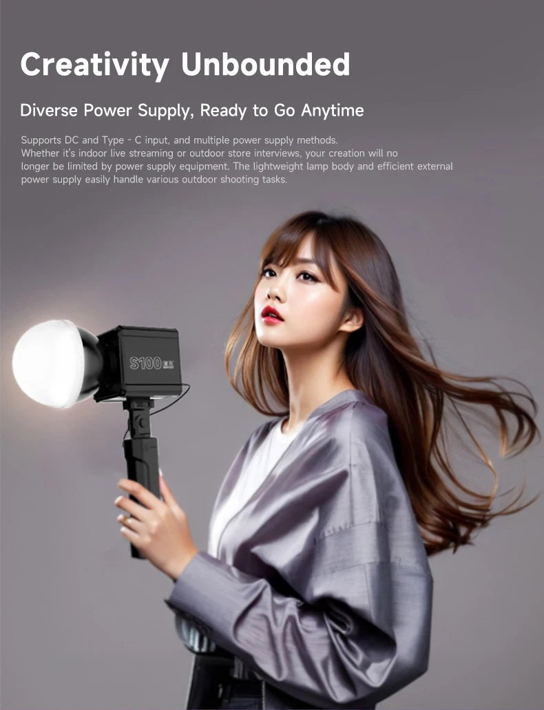 S100 portable LED video light with a white dome diffuser, mounted on a handheld grip for lighting during photography.