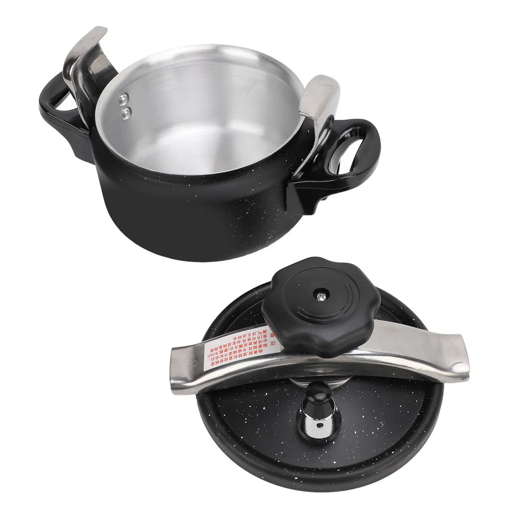 Black speckled pressure cooker with open lid showing stainless-steel inner pot and handles