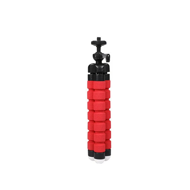 Flexible tripod with black head and red foam legs for mounting cameras and smartphones.