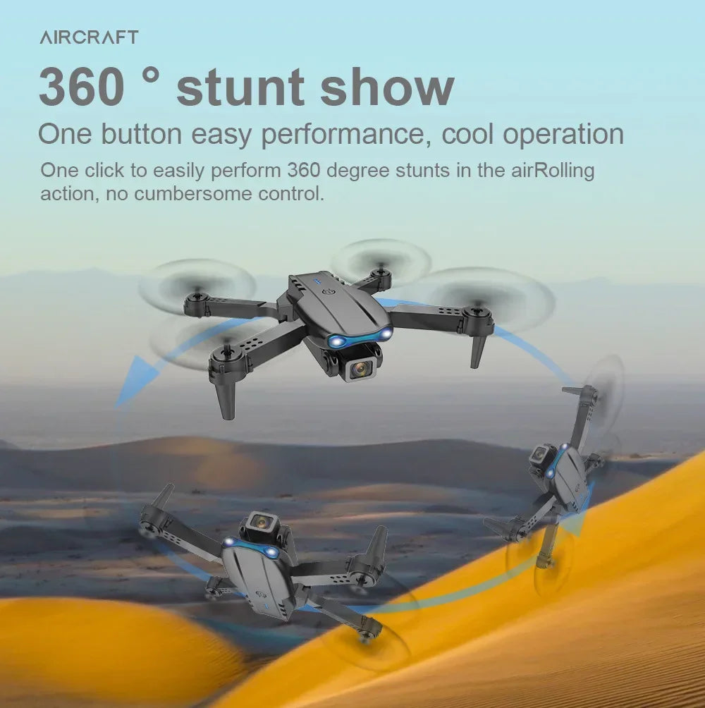 Black foldable quadcopter drone performing 360-degree aerial stunts with blue LED lights and a front-facing camera.