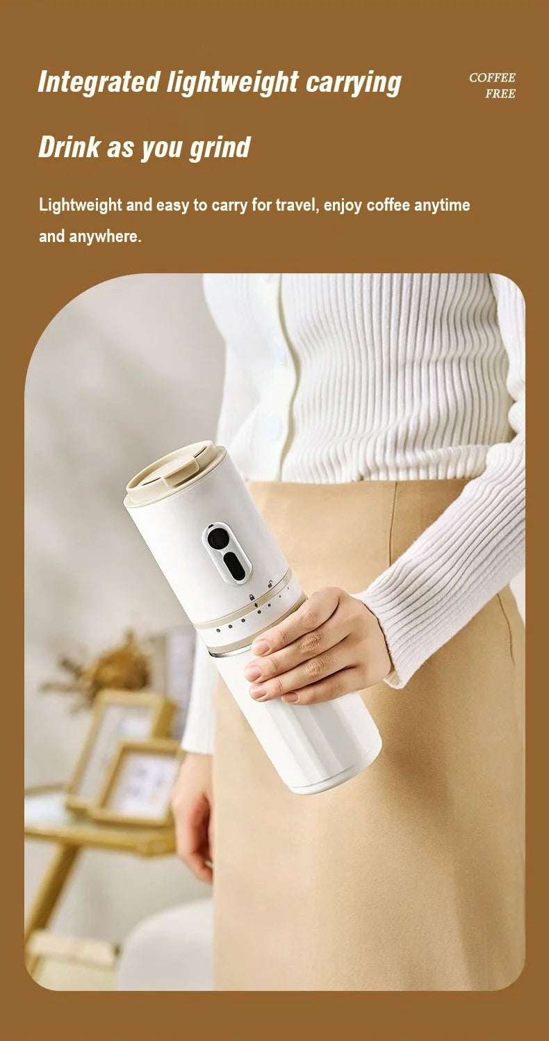 Portable white electric coffee grinder and travel mug with beige lid held in hand for travel.