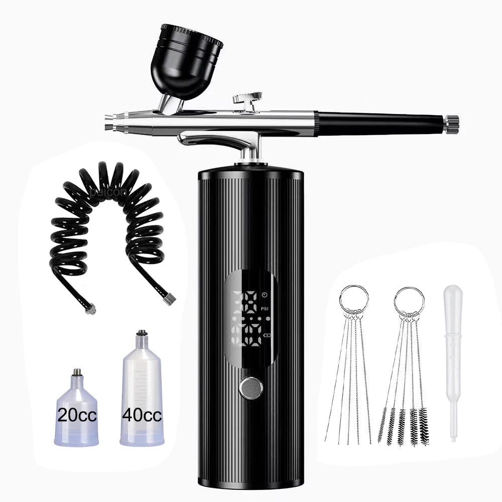Portable black airbrush kit for nail art, makeup, and cake decorating with compressor, hose, and fluid cups.