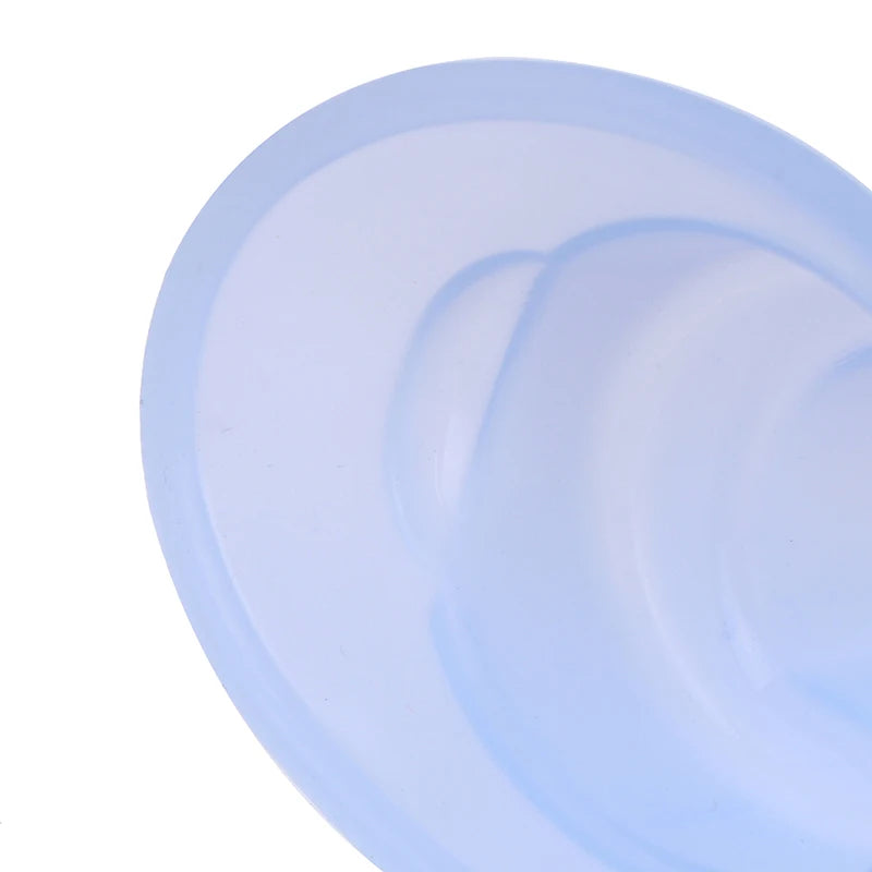 Blue reusable silicone eye wash cup for eye cleaning and health, soft ergonomic medical-grade eye bath tool.