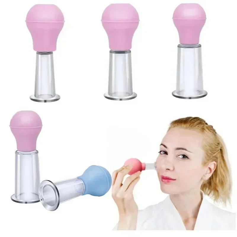 Set of clear plastic vacuum cupping jars with pink and blue rubber bulbs for facial massage and skin lifting.