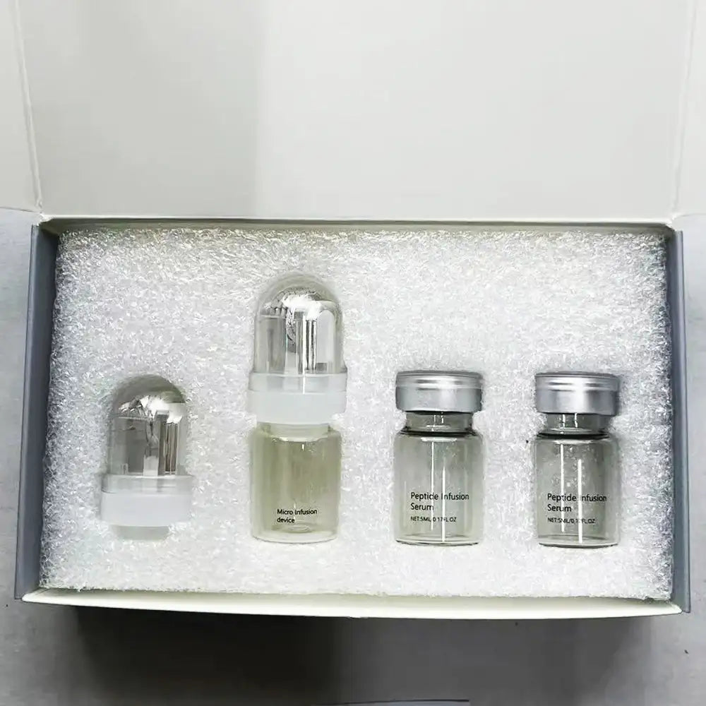 A skincare kit in a white box, featuring one micro-infusion device and two glass vials of Peptide Infusion Serum.
