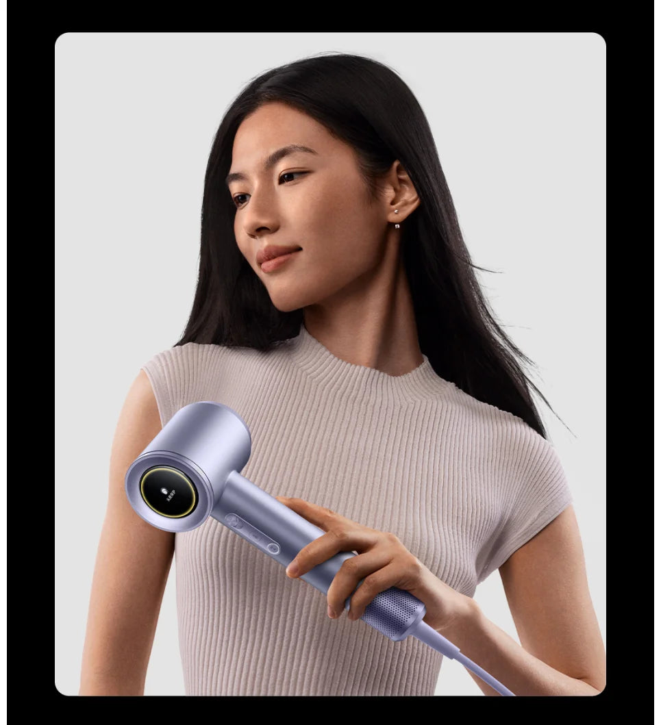 Purple MIJIA High-Speed Water Ion Hair Dryer Pro with digital display held by a woman for fast, salon-quality drying.