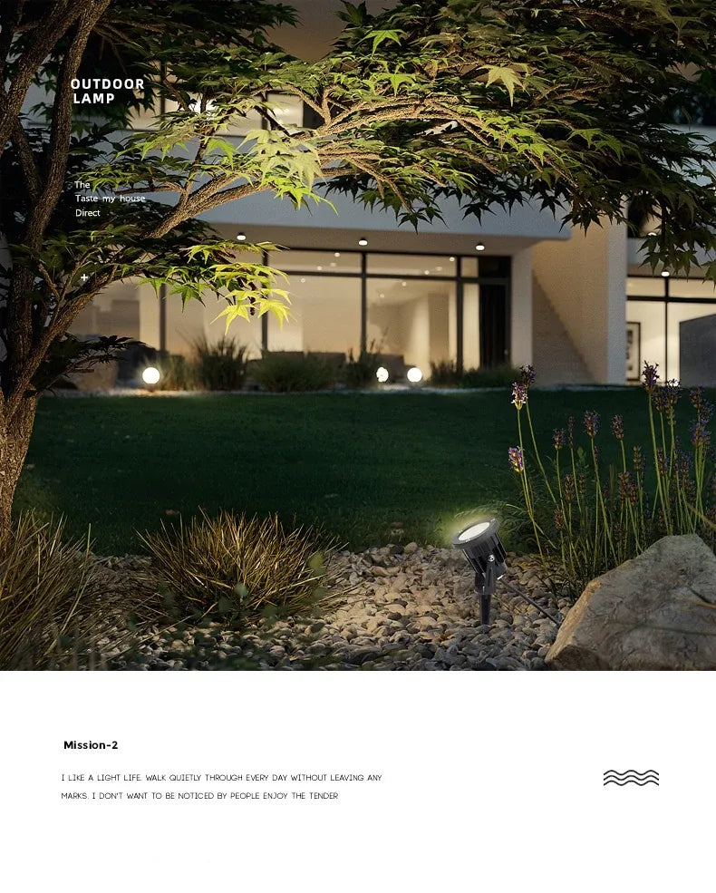 Outdoor LED garden spike light lighting a pathway near landscaping plants
