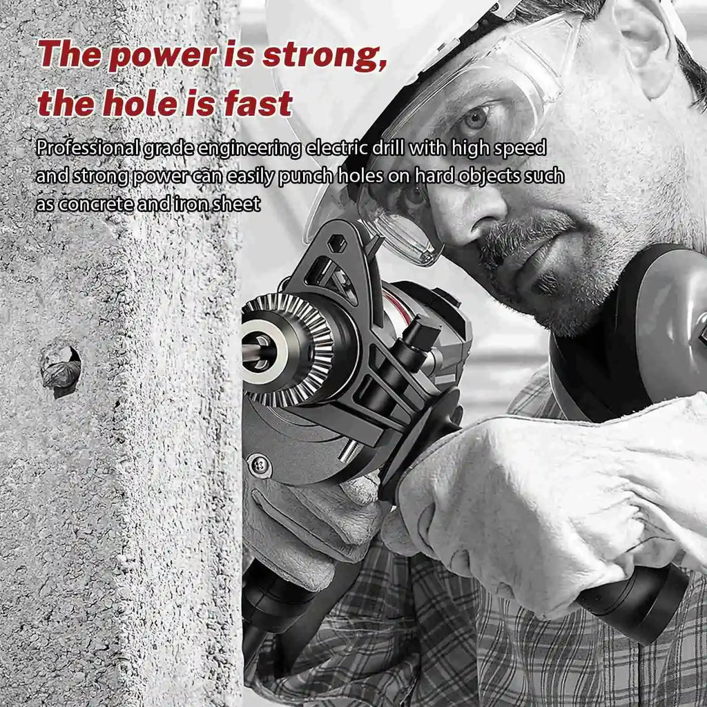Black electric drill driver with metal bit, held against a concrete wall