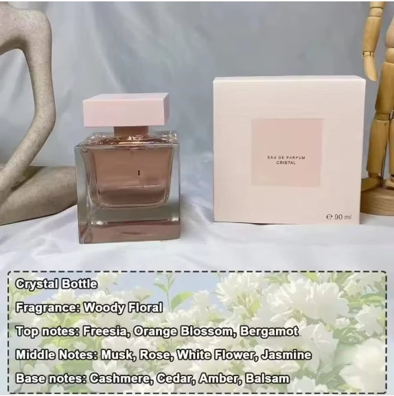 Eau de Parfum Cristal: Woody Floral women's perfume in a square glass bottle with musk, jasmine, and cedar notes.