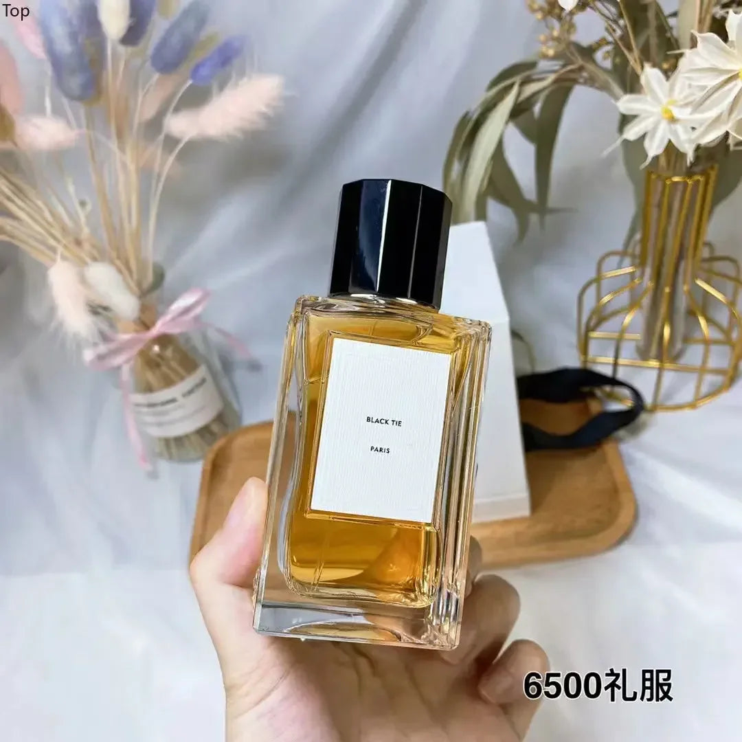 Dansparis Black Tie unisex perfume in a square glass bottle with a black cap. Long-lasting luxury EDP fragrance.