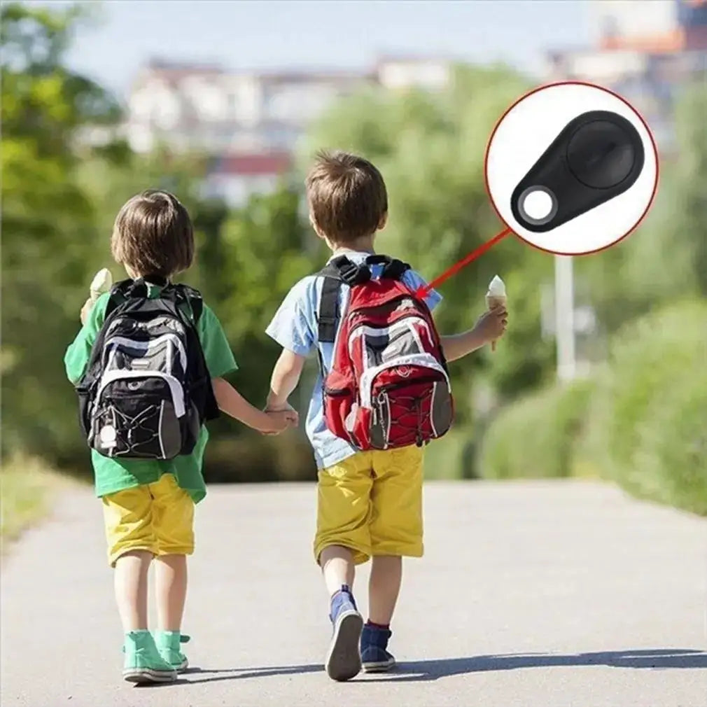 Black mini wireless GPS tracker for pets and bags. Bluetooth anti-lost smart tag for real-time app location tracking.