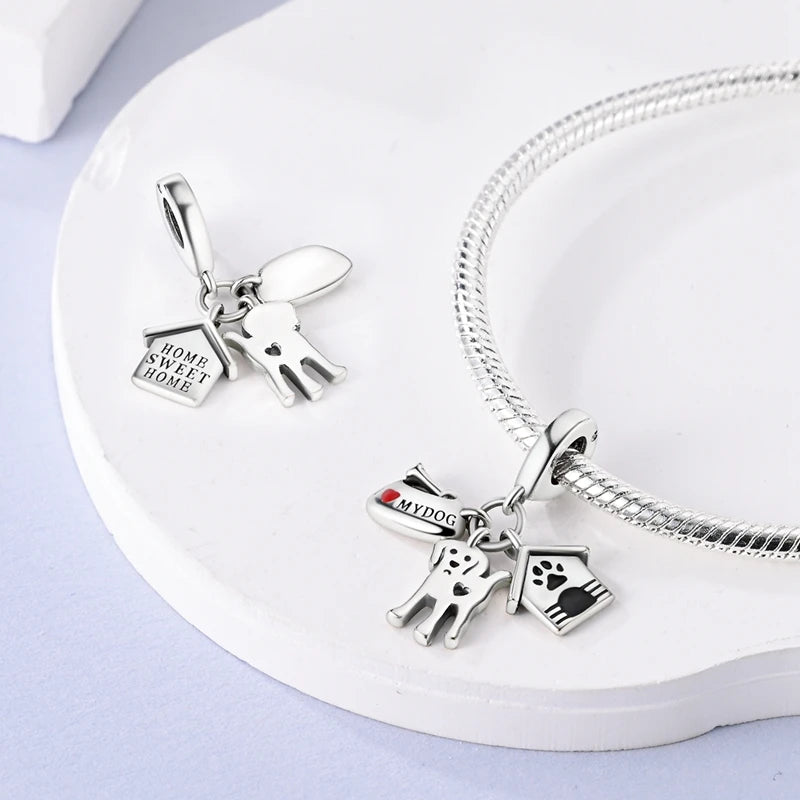 Cute 925 sterling silver dog charms with house and paw prints for DIY charm bracelets and pet lover jewelry.