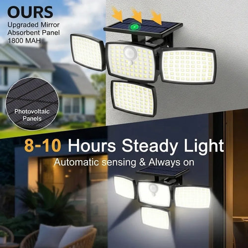 Black 4-head outdoor solar flood light mounted on a wall with top solar panel and bright LED panels.