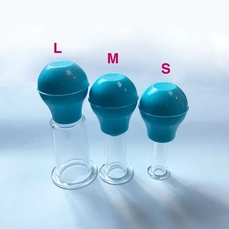 Three facial massage vacuum cups in size large, medium, and small, with blue rubber bulbs and clear glass bases.