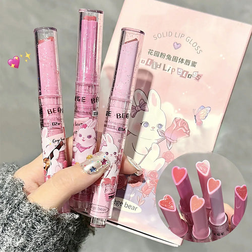 Gege Bear moisturizing solid lip gloss in pink rabbit packaging with heart-shaped, watery colored lipstick bullet.
