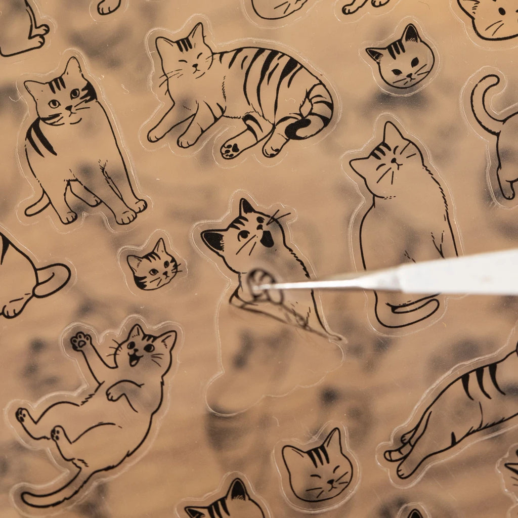 Cute cartoon cat PET stickers for scrapbooking and DIY craft projects. Transparent adhesive decals for pet decor.