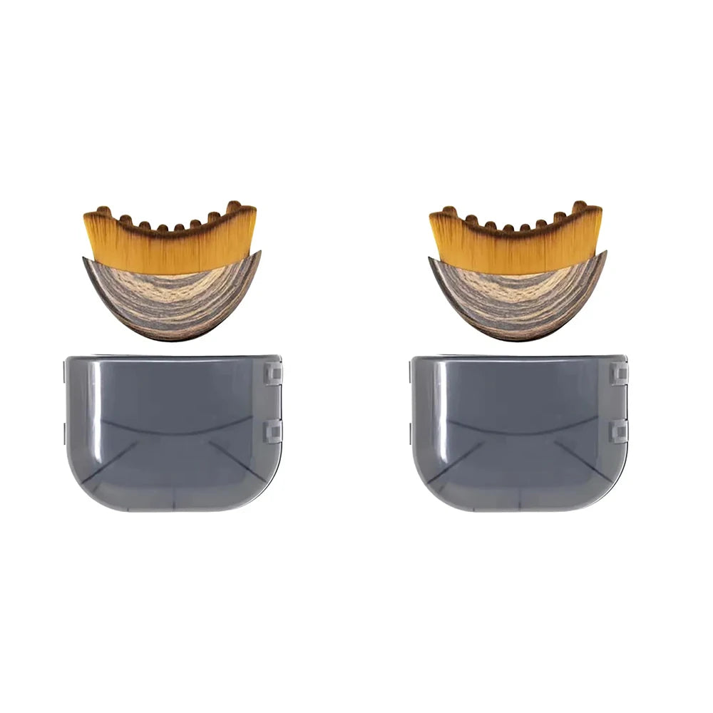 Two ergonomic contour facial brushes with wooden-patterned bases, amber bristles, and grey protective plastic covers.