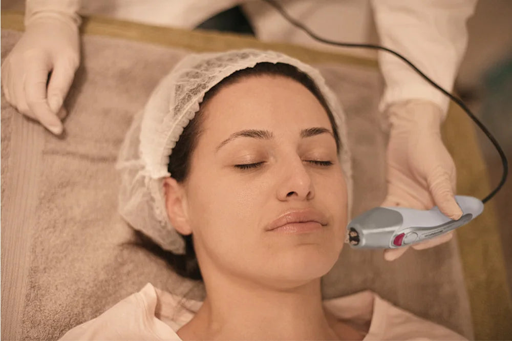 Korean Dot Matrix RF skin lifting and rejuvenation device used on a woman's face in a spa setting.