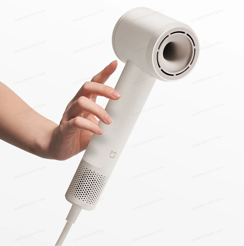 MIJIA high-speed hair dryer in white, sleek lightweight design, powerful salon-grade airflow, held by hand.
