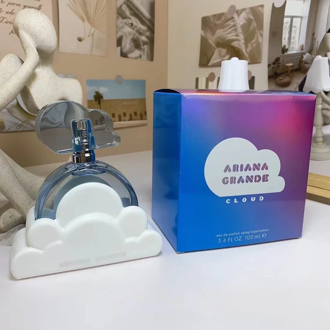 Ariana Grande Cloud EDP 100ml: Women’s fragrance with iconic white cloud bottle design and iridescent purple gift box.