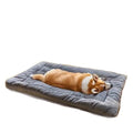 Extra large plush gray dog bed with soft polyester filling, providing comfort for dogs sleeping in a crate.