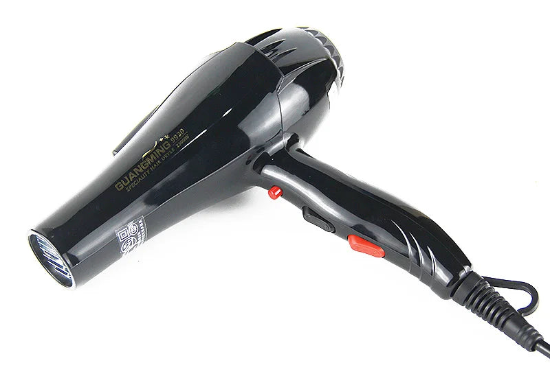 Professional black salon hair dryer, 2100W power, ergonomic design with red speed and heat control switches.