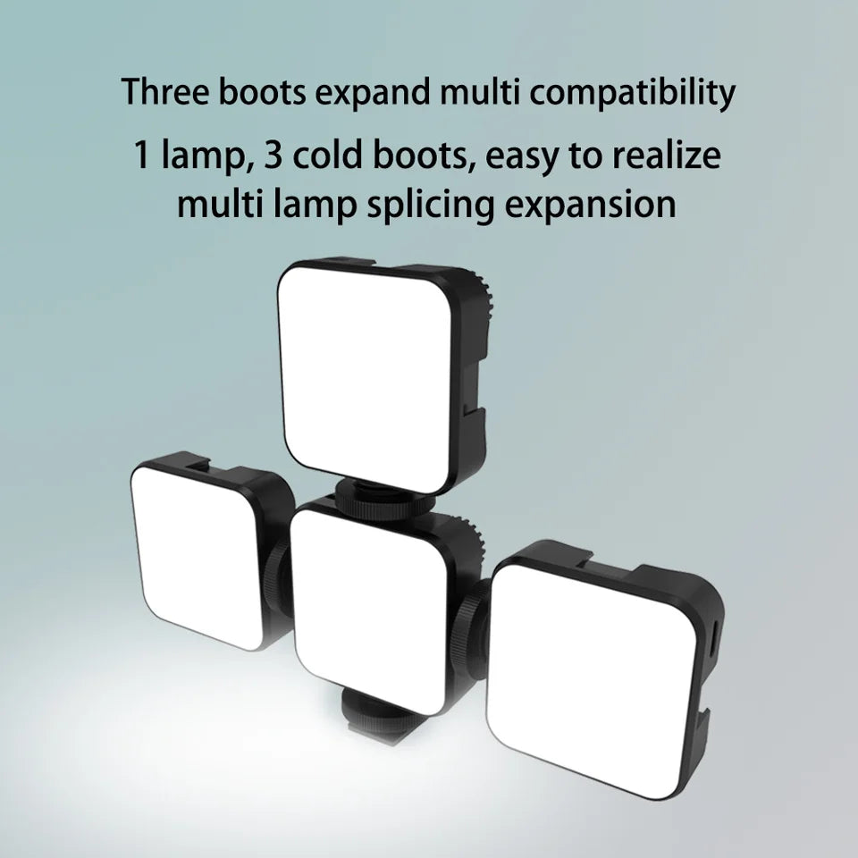 Three square LED video lights in a black housing, connected via cold shoe mounts for modular lighting expansion.