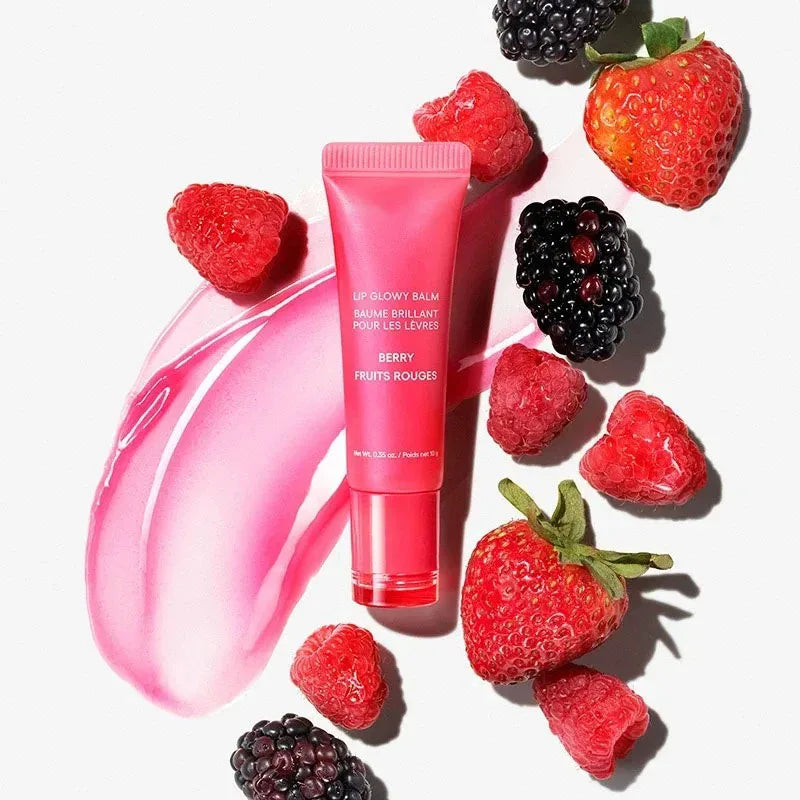 Laneige Berry Lip Glowy Balm tube with glossy pink texture swatch, surrounded by fresh strawberries and blackberries.