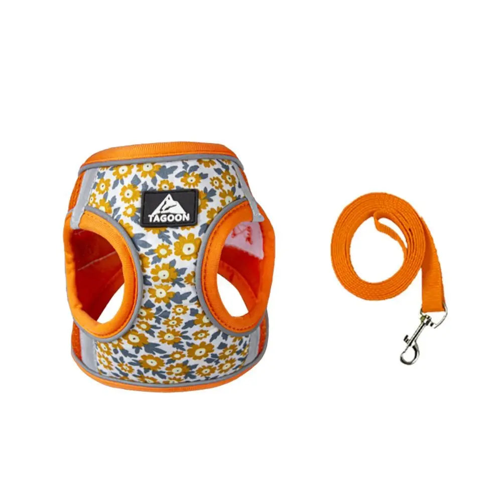 Adjustable orange floral pet harness and leash set for small dogs and cats, reflective and breathable mesh for safety.