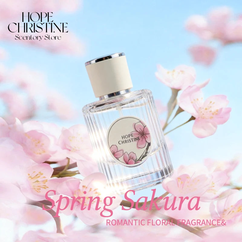 Glass bottle of Hope Christine Cherry Blossom perfume with a cream cap, surrounded by pink sakura flowers.