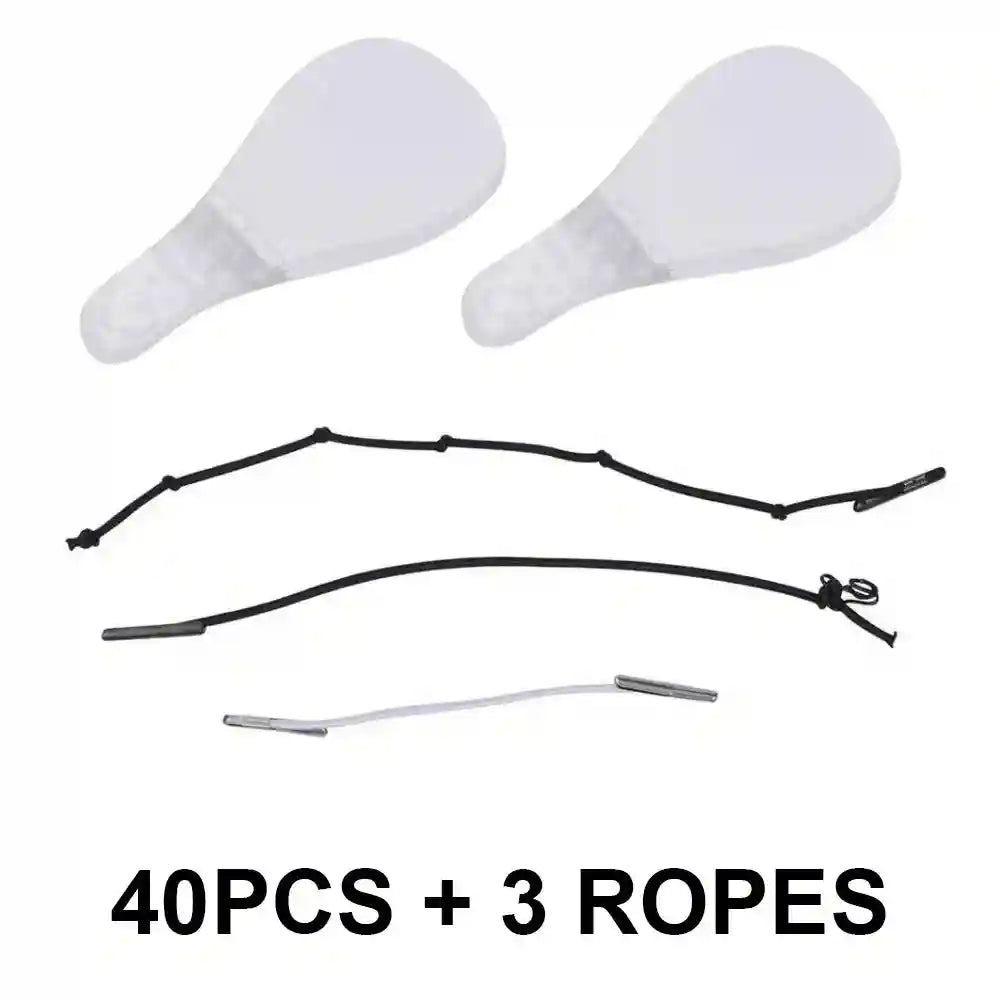 Two clear, teardrop-shaped adhesive face lift patches and three thin elastic tightening cords on a white background.