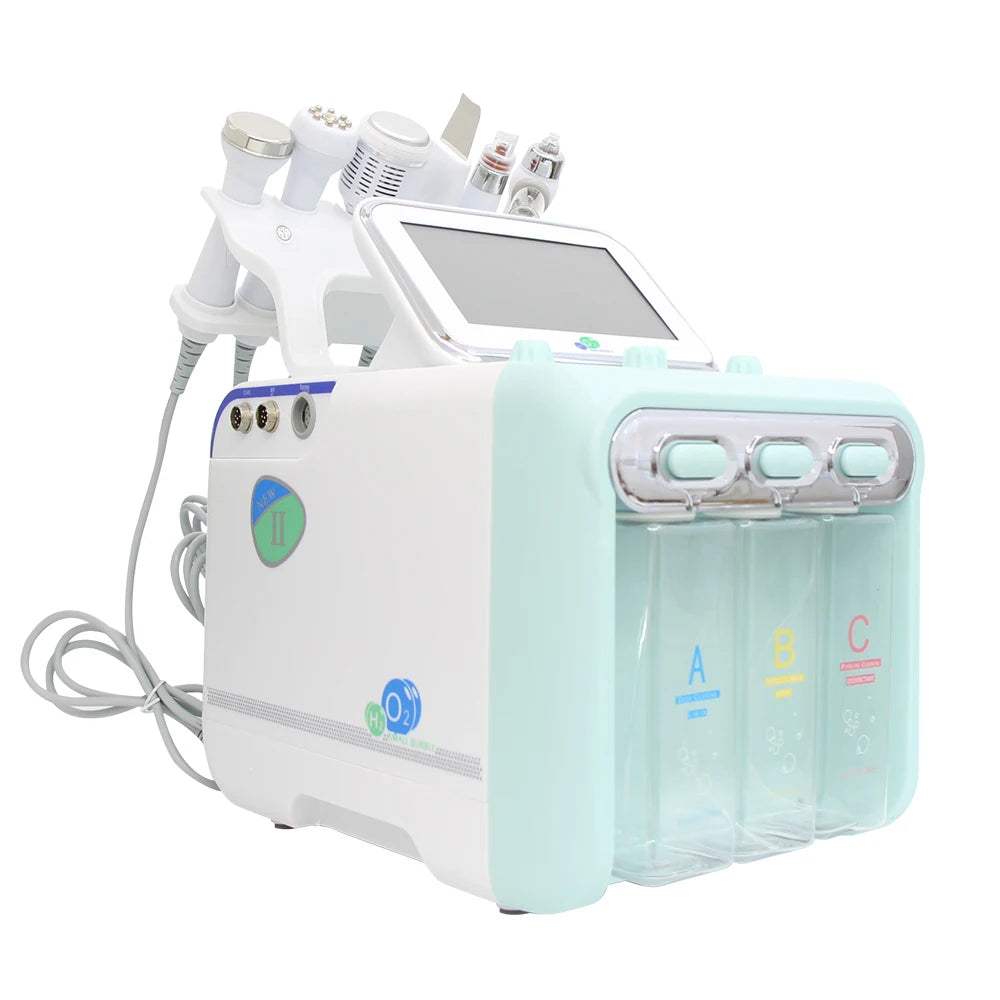 White and mint H2O2 hydro dermabrasion spa facial machine with multiple treatment probes and three solution bottles.