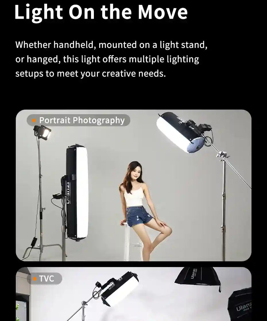 Long, cylindrical, black and white LED video light on a tripod stand, used for portrait and professional lighting.