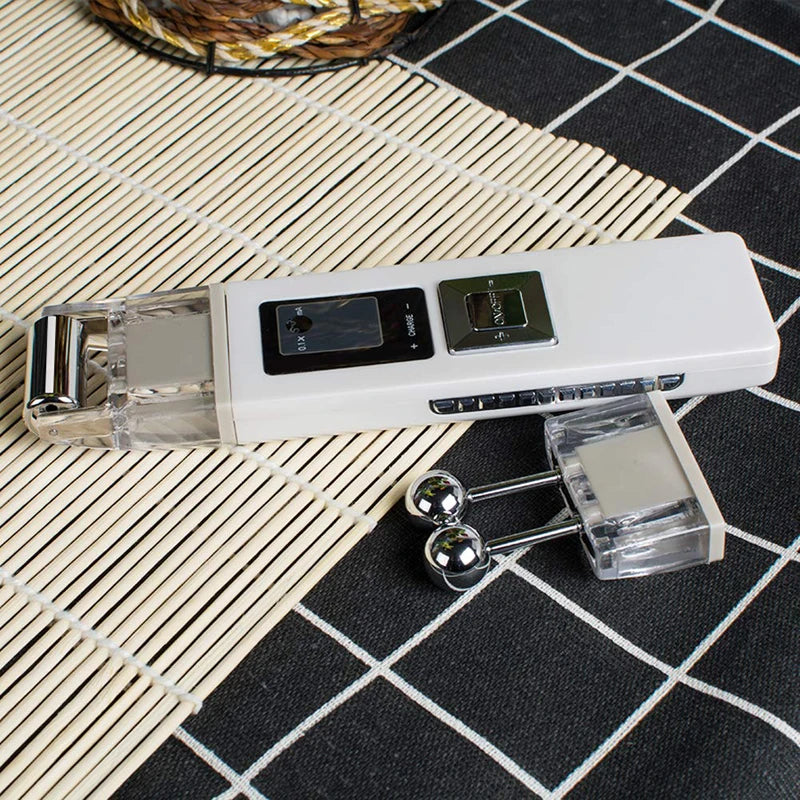 White, rectangular wireless facial lifting device with interchangeable metal roller heads on a bamboo mat.