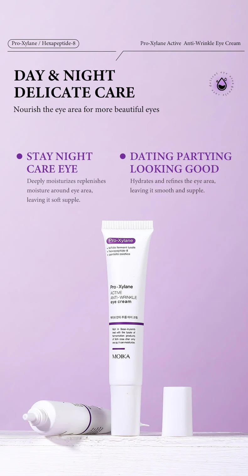 Pro-Xylane anti-wrinkle eye cream in a white squeeze tube on a light purple background for dark circles and puffiness.