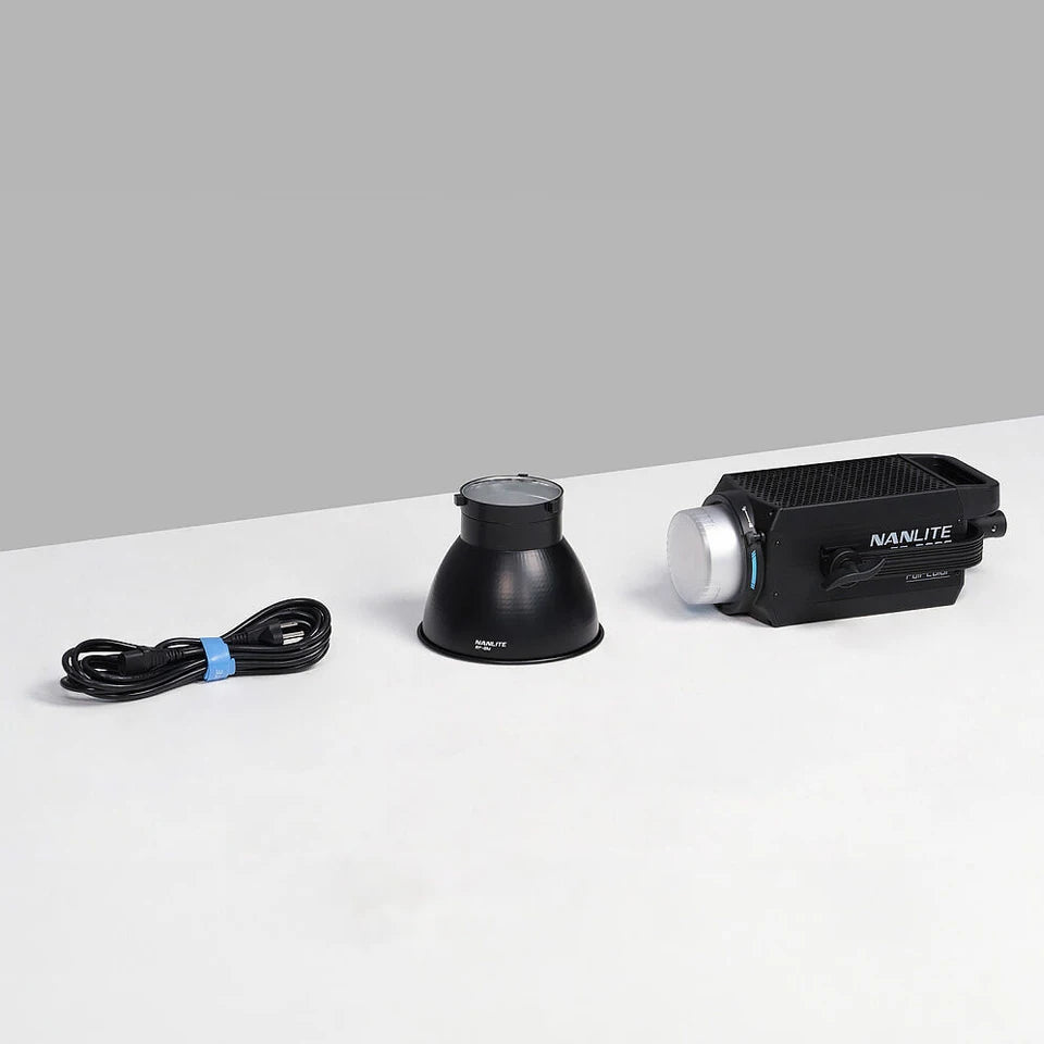 Black LED studio light with a reflector bowl and power cable on a white surface for professional video lighting.