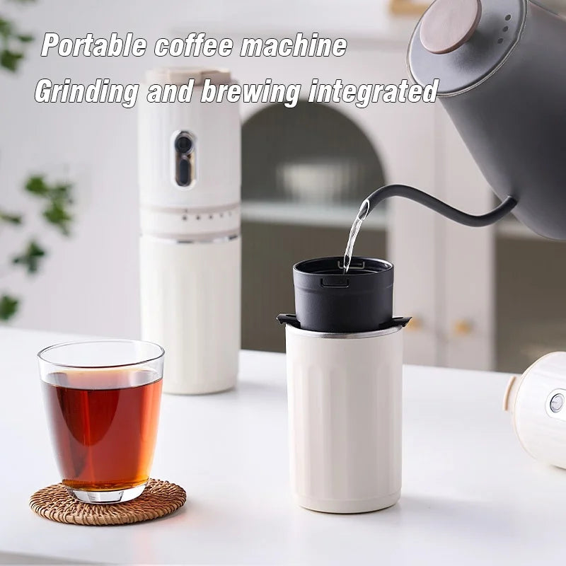 White portable coffee maker with integrated grinder, pouring hot water into a cup with a black dripper filter.