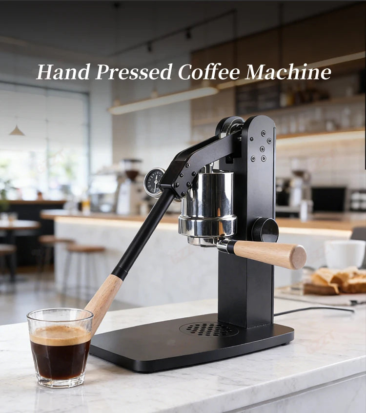 Black manual lever espresso maker with metal frame, wooden handle, and pressure gauge on a marble kitchen counter.