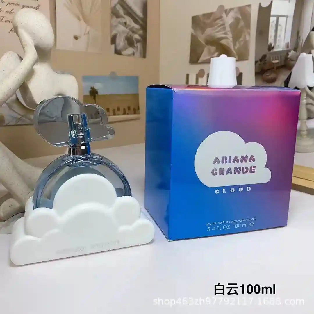Ariana Grande Cloud EDP 100ml perfume for women. Iconic white cloud bottle and blue iridescent box. Long-lasting scent.