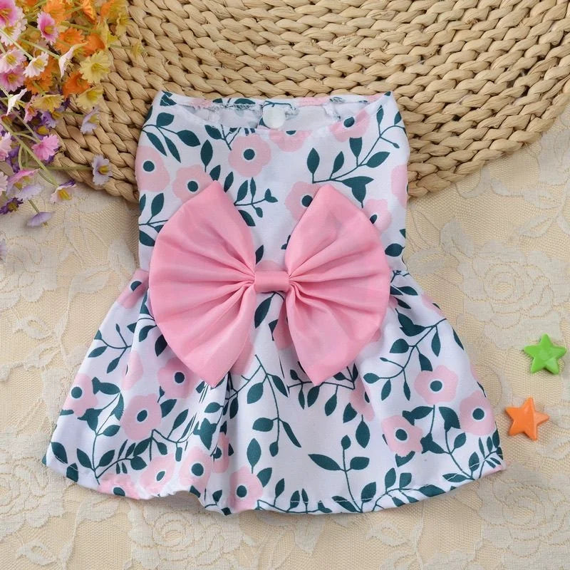 Floral spring dog princess dress with large pink bow for small puppy or kitten. Cute, breathable summer pet skirt.