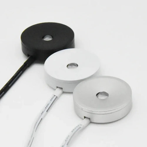 USB flat recessed puck lights set with white and black housings and cable leads