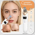White and gold rechargeable blackhead vacuum pore extractor with suction tips for facial cleansing and skin care.