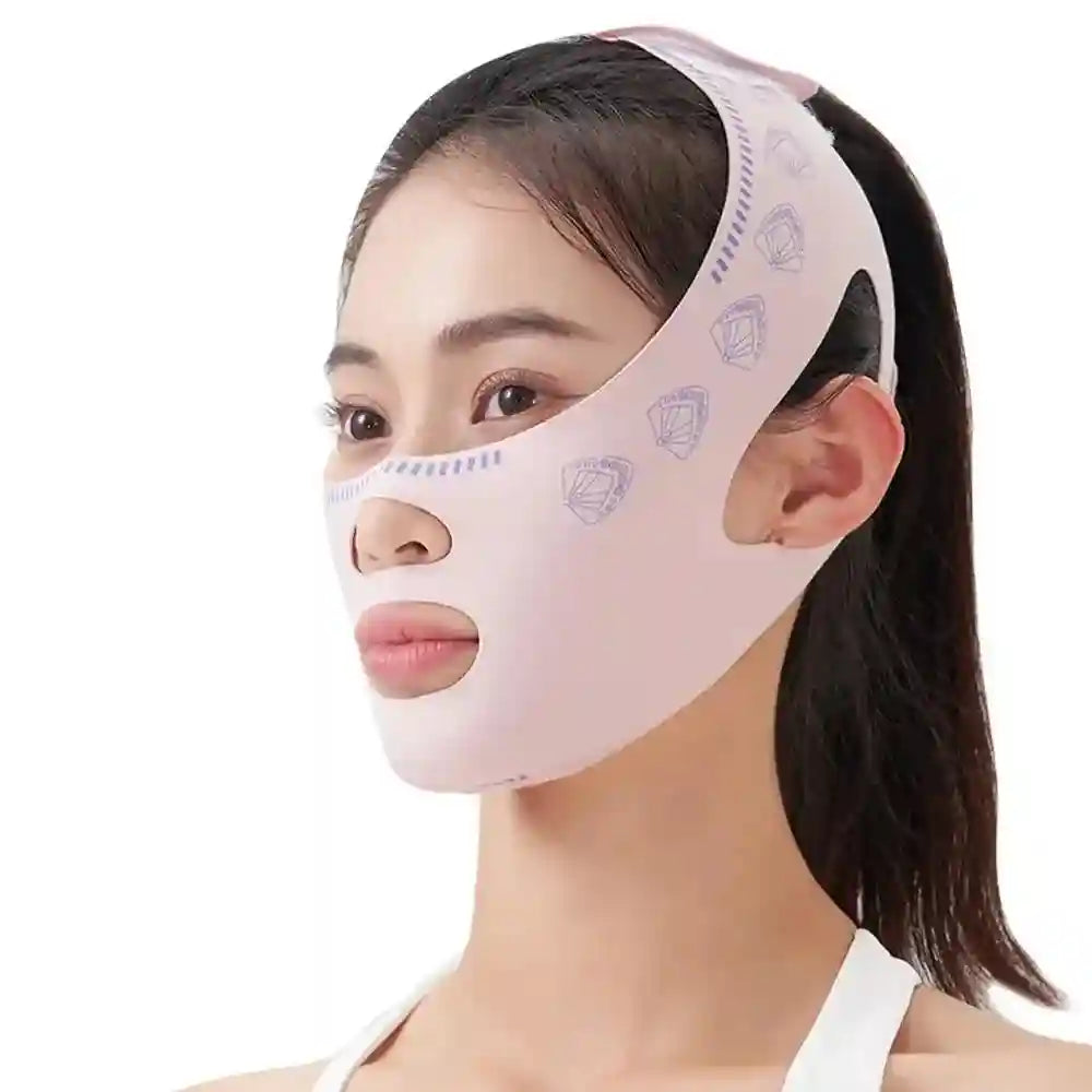 A woman wears a pale pink face-lifting bandage with small purple fan patterns, designed for chin and cheek slimming.