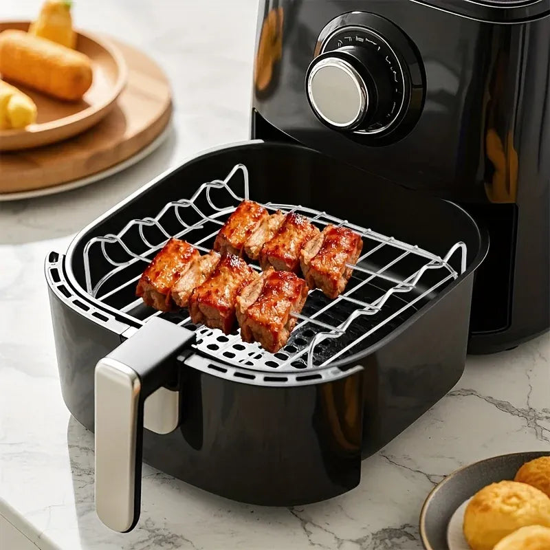 Air fryer grill rack with four meat skewers in the round air fryer basket