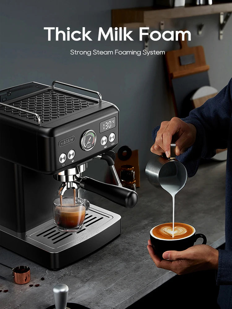 HiBrew matte black espresso machine with digital display and steam wand pouring milk foam into a cup for latte art.