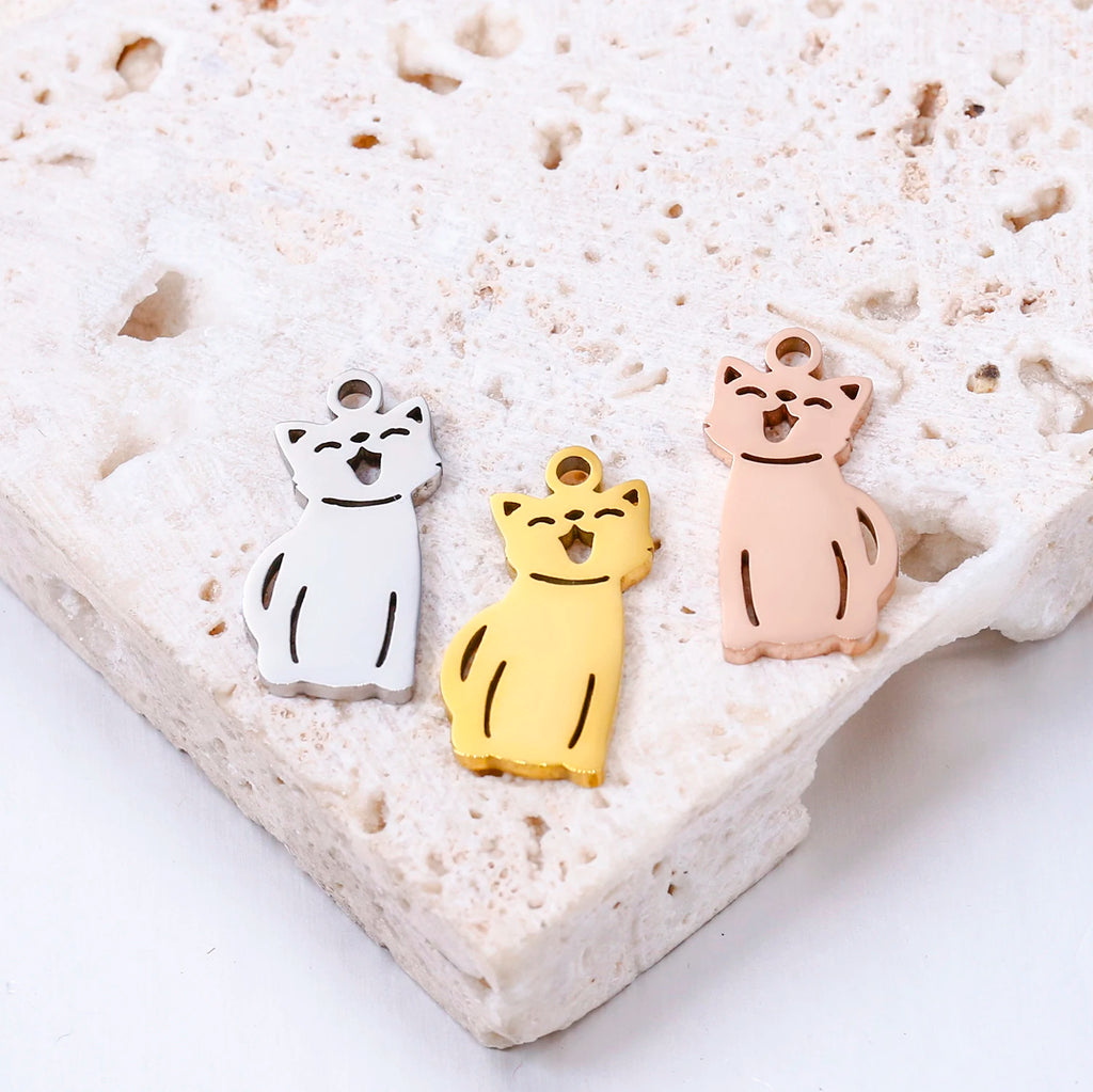 Stainless steel cat charms in silver, gold, and rose gold for DIY pet jewelry necklaces and bracelets.