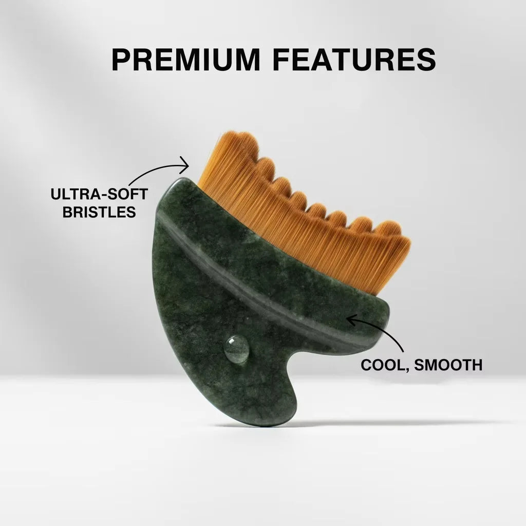 A dark green, stone-like contoured gua sha tool featuring a row of dense, ultra-soft brown bristles.
