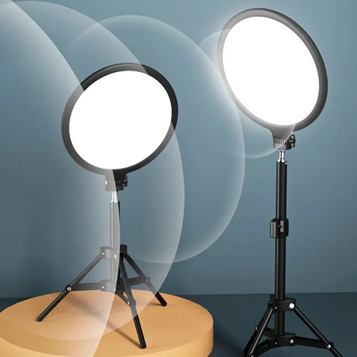 Two circular LED ring lights with black stands on tripods, used for photography and video lighting.