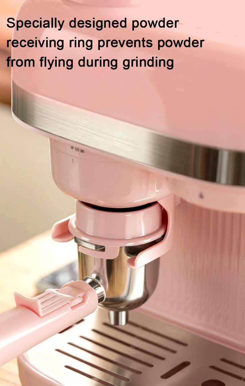 Pink espresso machine with stainless steel portafilter and anti-spill grinding ring for mess-free coffee preparation.